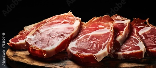Assorted Cuts of Fresh Raw Meat on a Rustic Wooden Cutting Board for Culinary Preparation