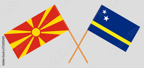 Crossed flags of North Macedonia and Country of Curacao. Official colors. Correct proportion