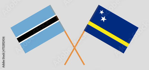 Crossed flags of Botswana and Country of Curacao. Official colors. Correct proportion