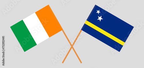 Crossed flags of Ivory Coast and Country of Curacao. Official colors. Correct proportion