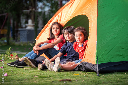 Indian Children in a tent. Camping. Happy kids at summer vacations