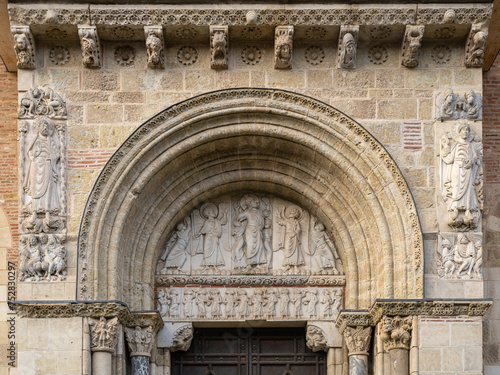 Valokuva View of the ancient romanesque tympanum representing the Ascension of Christ wit