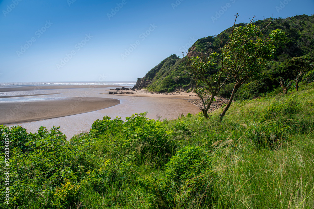 Port St Johns, umzimvubu river mouth, Wild Coast, known also as the Transkei, open beaches, steamy jungle or coastal forests. The rugged and unspoiled Coastline South Africa Port St Johns, umzimvubu river mouth, Wild Coast, known also as the Transkei, open beaches, steamy jungle or coastal forests. The rugged and unspoiled Coastline South Africa