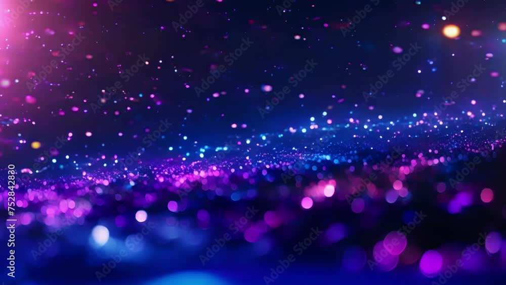 A vibrant canvas of swirling particles in shades of blue and purple ...
