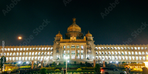 Night view of Vidhana Soudha, a building in Bangalore, India which serves as the seat of the state legislature of Karnataka, India.  photo