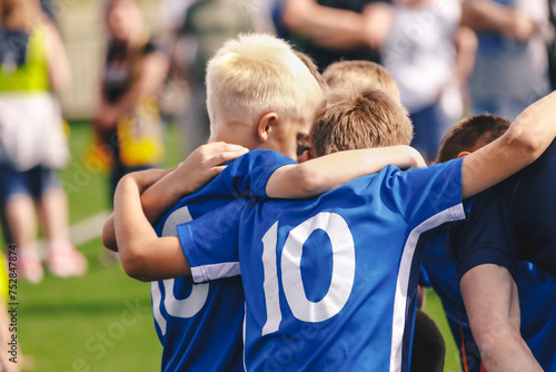 Children in Sports Team. Friends on a Soccer Team. Male Football Players Huddling Together in a Circle Before a Match