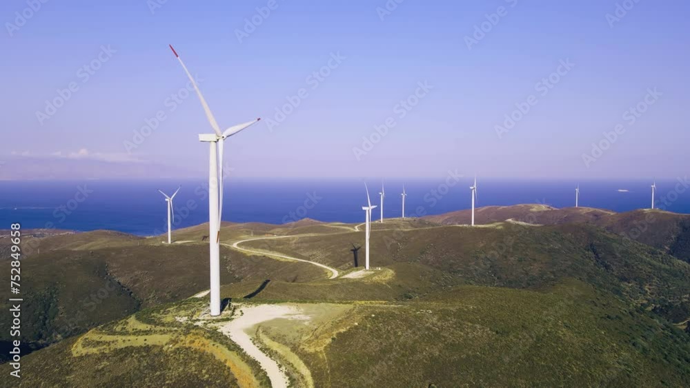 Wind power station for zero emission Carbone seascape in background, Aerial wide shot Wind power station for zero emission Carbone seascape in background, Aerial wide shot