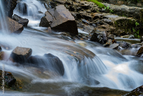 small waterfall with a small lake near Bhimtal. Landscape view of a small waterfall in the mountains. crystalline waterfall.