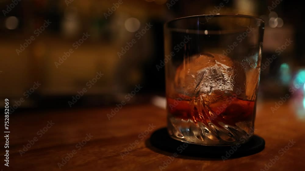 Whiskey Glass on a Bar Counter Whiskey Glass on a Bar Counter