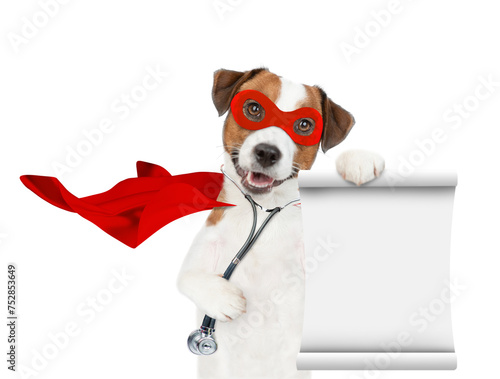 jack russell terrier wearing like a doctor with superhero cape and with stethoscope on his neck looks at camera and shows empty list. Isolated on white background