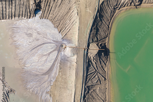  Settling tanks and clarifiers are on wastewater treatment plant. Industrial coal mine, abstract sendimentation tank of mine in Poland. Industrial lake Aerial drone photo view