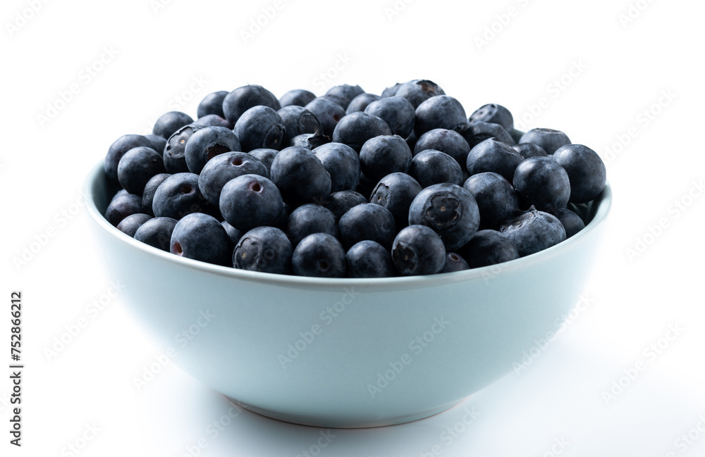 Blueberries in green bowl isolated on white background Blueberries in green bowl isolated on white background