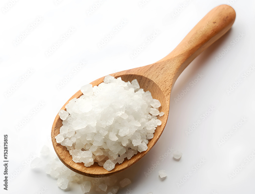 Sea salt in a wooden spoon close-up Sea salt in a wooden spoon close-up