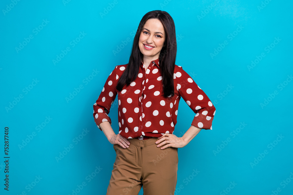 Photo portrait of lovely lady confident entrepreneur pose wear trendy dotted red garment isolated on blue color background Photo portrait of lovely lady confident entrepreneur pose wear trendy dotted red garment isolated on blue color background