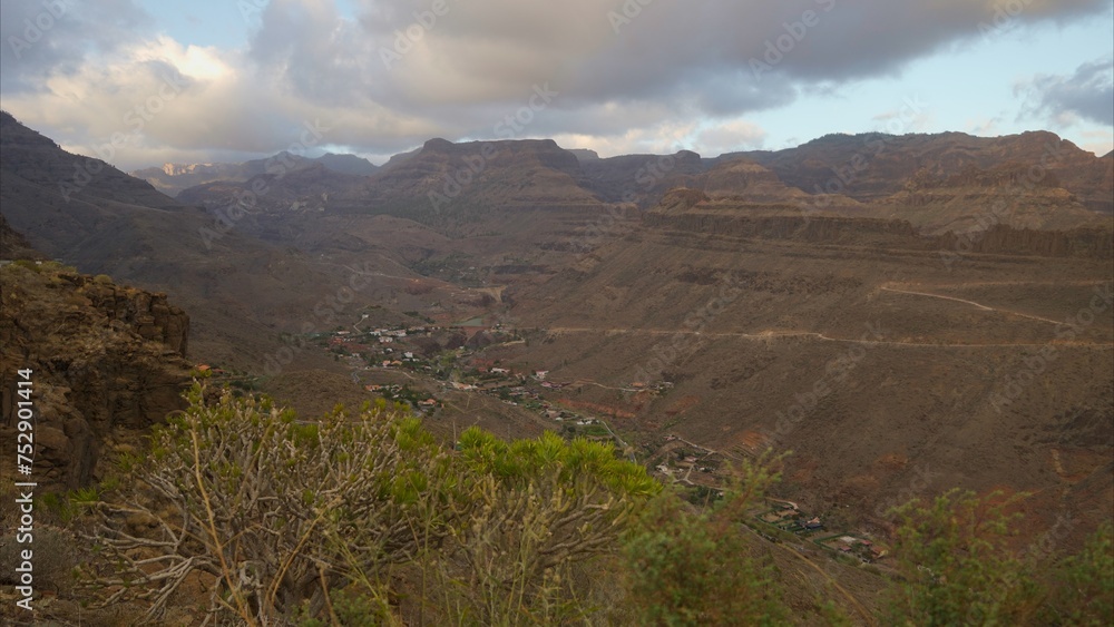 Arid and rocky mountains with dry vegetation in the hinterland of the Canary Islands due to too much heat. Global warming concept Arid and rocky mountains with dry vegetation in the hinterland of the Canary Islands due to too much heat. Global warming concept