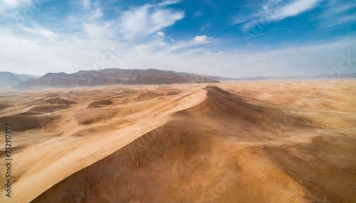 Desert tropical weather, dry land, dunes and a beautiful blue sky, sand