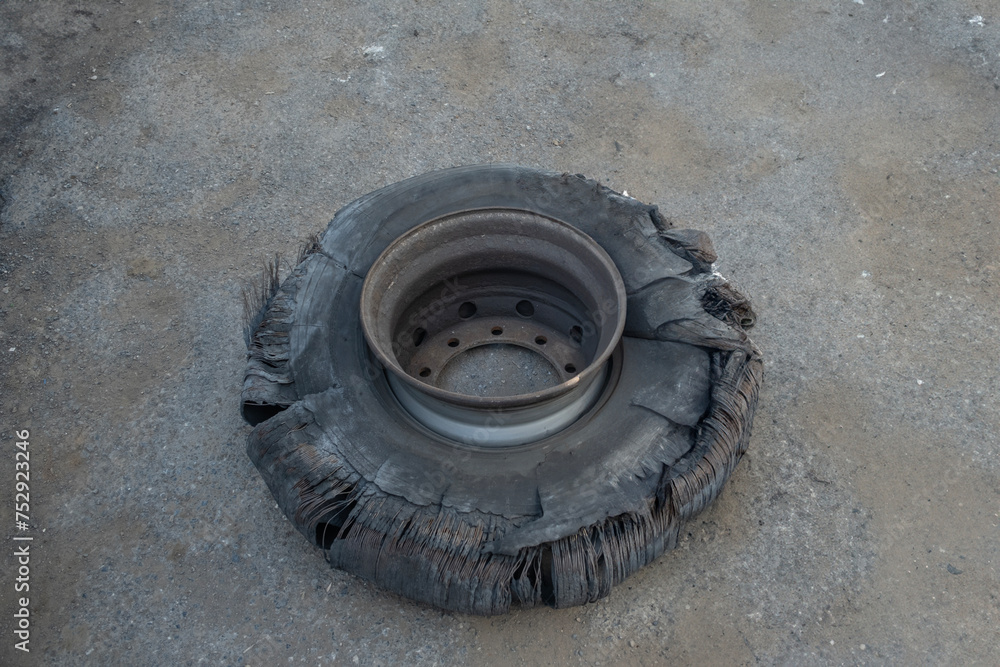 Old worn, shattered truck wheel. Worn and old Tyre.