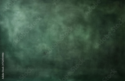 Dark green blurred background for portrait. Portrait backdrop for studio. Empty grunge wall.