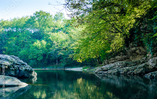 rocky shore of a mountain river in Martville Canyon in Georgia photo