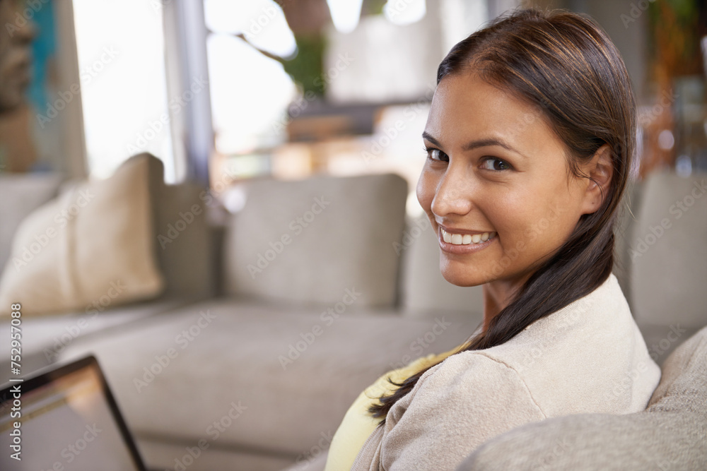 Portrait, woman or laptop on couch on internet, website or social media for browsing in living room. Female person, smile and computer on sofa to relax, search and reading of email at weekend Portrait, woman or laptop on couch on internet, website or social media for browsing in living room. Female person, smile and computer on sofa to relax, search and reading of email at weekend