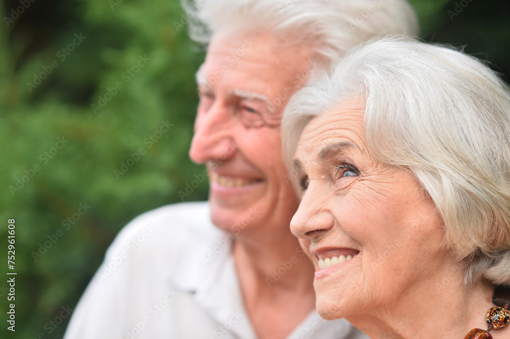 Portrait of happy elderly couple posing in park Portrait of happy elderly couple posing in park