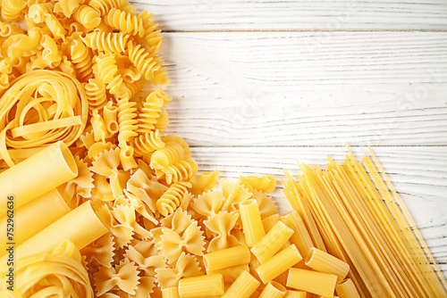 Variety of types and shapes of dry Italian pasta photo