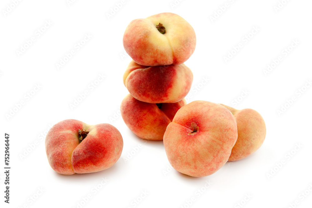 Several saturn peaches or flat peaches isolated on white background with clipping path.. Several saturn peaches or flat peaches isolated on white background with clipping path..