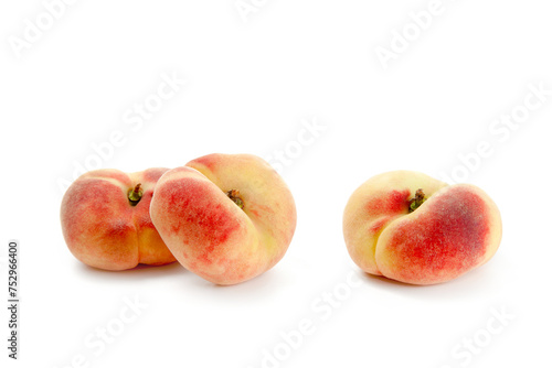 Three saturn peaches or flat peaches isolated on white background with clipping path..