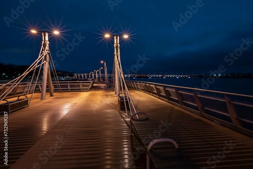 Night view of a bridge on the Vistula river, Plock, Poland photo