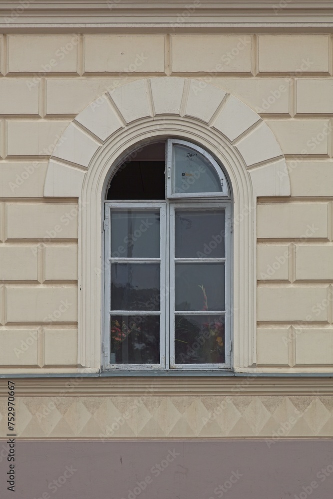 Yellow stone building with arch window. Yellow stone building with arch window.