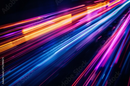 An image featuring streaks of neon lights in motion against a dark background.