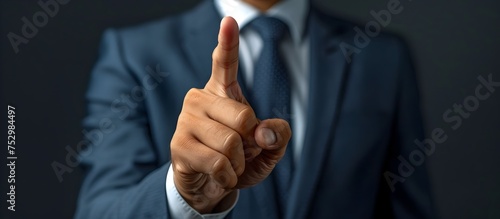 Pointing Businessman in Suit, To convey a sense of authority and decisiveness in the world of business photo