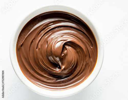 Melted milk chocolate in bowl isolated on white, top view