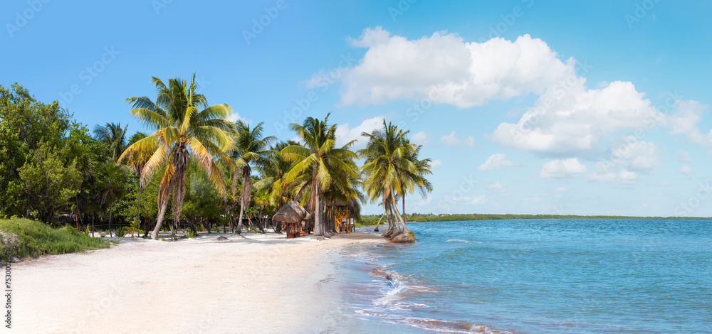 Paradise Sunny beach with palms and turquoise sea. Summer vacation and tropical beach concept - Cancun, Mexico