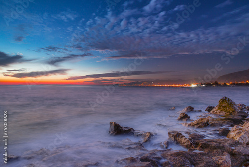 Fototapeta Naklejka Na Ścianę i Meble -  Long exposure photo of sunset on a rocky beach - Alanya, Turkey