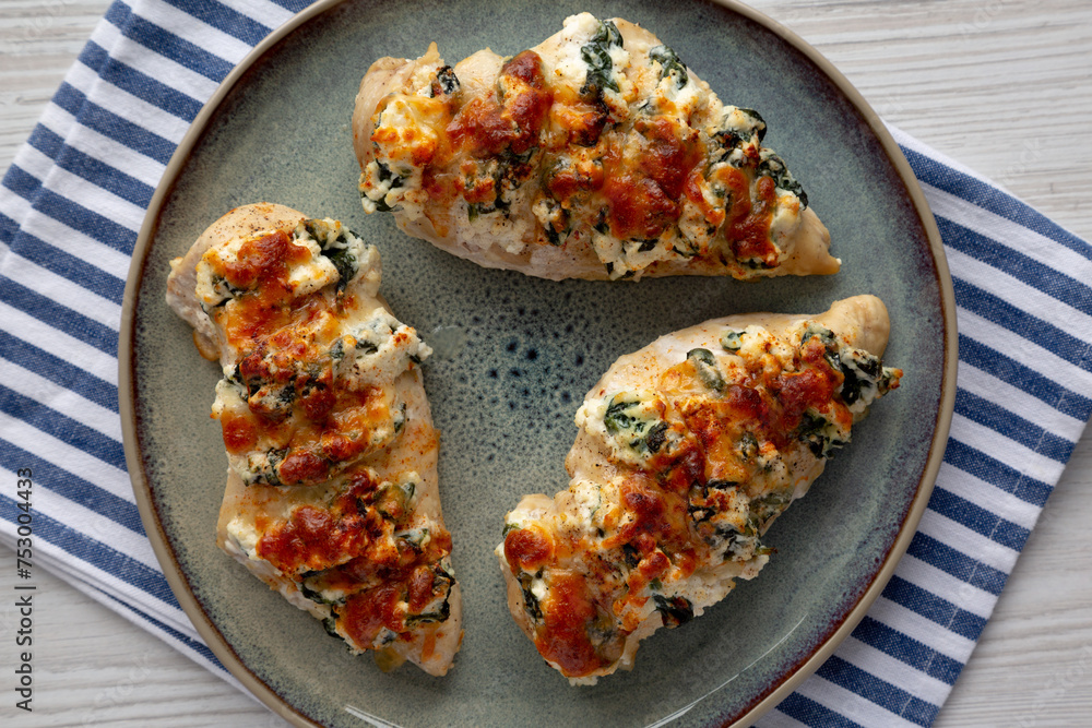 Homemade Hasselback Chicken on a Plate, top view. Flat lay, overhead, from above. Homemade Hasselback Chicken on a Plate, top view. Flat lay, overhead, from above.