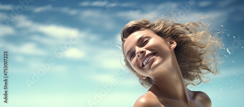 Serene Beauty: Woman Enjoying the Breeze with Hair Blowing in the Wind © HN Works