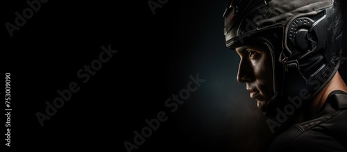 Determined Cyclist in Helmet Against Moody Black Background Showing Strength and Focus