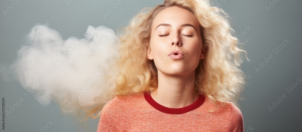 Sensual Woman with Blonde Hair Exhaling a Cloud of Smoke in Urban Setting Sensual Woman with Blonde Hair Exhaling a Cloud of Smoke in Urban Setting