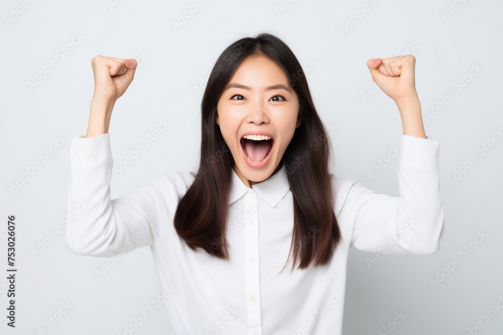 Woman feeling good celebrating raising arms fists