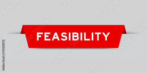 Red color inserted label with word feasibility on gray background