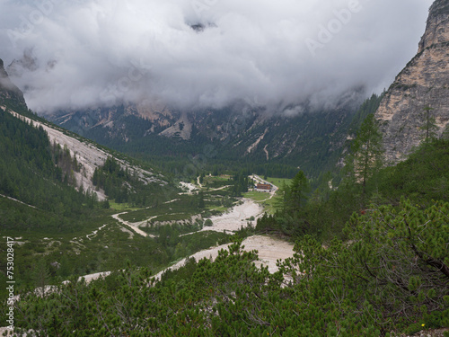 Gravel Path on a Road in the Italian Alps Mountains on a Cloudy Summer day, Italy © GioRez