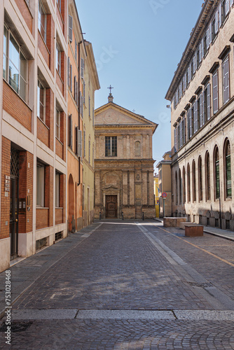 A Street in Parma and in the Background the deconsecrated Renaissance Church of San Marcellino, Italy