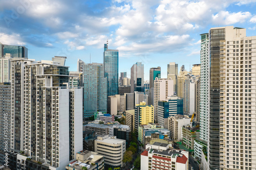 Makati, Philippines - Aerial shot of Makati's bustling skyline, showcasing a blend of mid-20th century and modern architecture and city vibes.