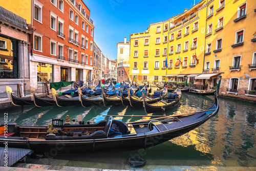 Bacino Orseolo channel gondolas and colorful architecture of Venice view photo