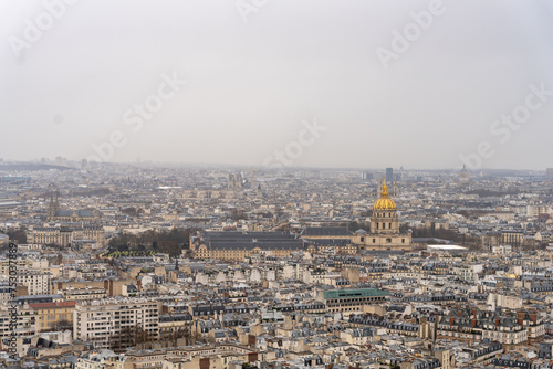 A city view with a large yellow dome in the middle © oybekostanov