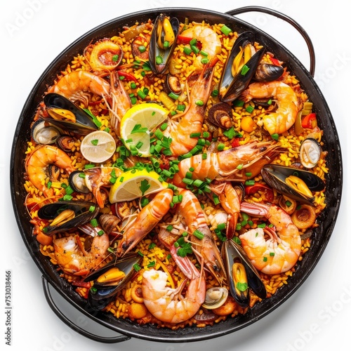 Traditional Spanish paella in a cast iron pan, garnished with shrimp and mussels, isolated on a white background