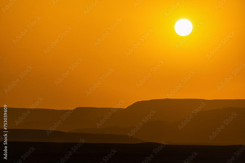 Sun setting over the desert in Luxor, Egypt Sun setting over the desert in Luxor, Egypt