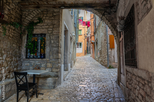 beautiful street of Rovinj Croatia with cobblestone looking through an arch tunel
