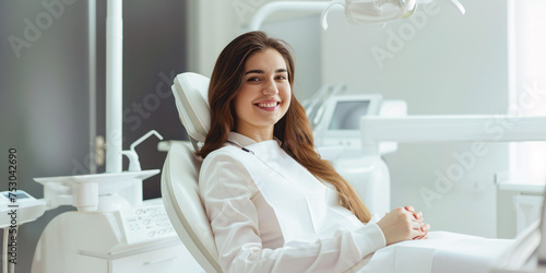 Beautiful smiling young woman is sitting in dental chair in clinic. Doctor is preparing for examination of teeth with tools. Dental clinic promotion. Teeth whitening  dental treatment  oral hygiene